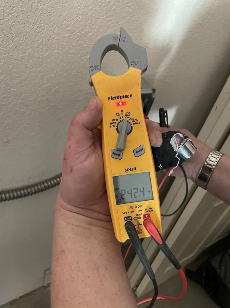 Voltage testing with clamp meter during Generator Installation in Blacklick Estates